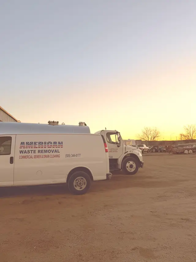 AWR service van lettered for commercial sewer and drain cleaning, parked at sunset